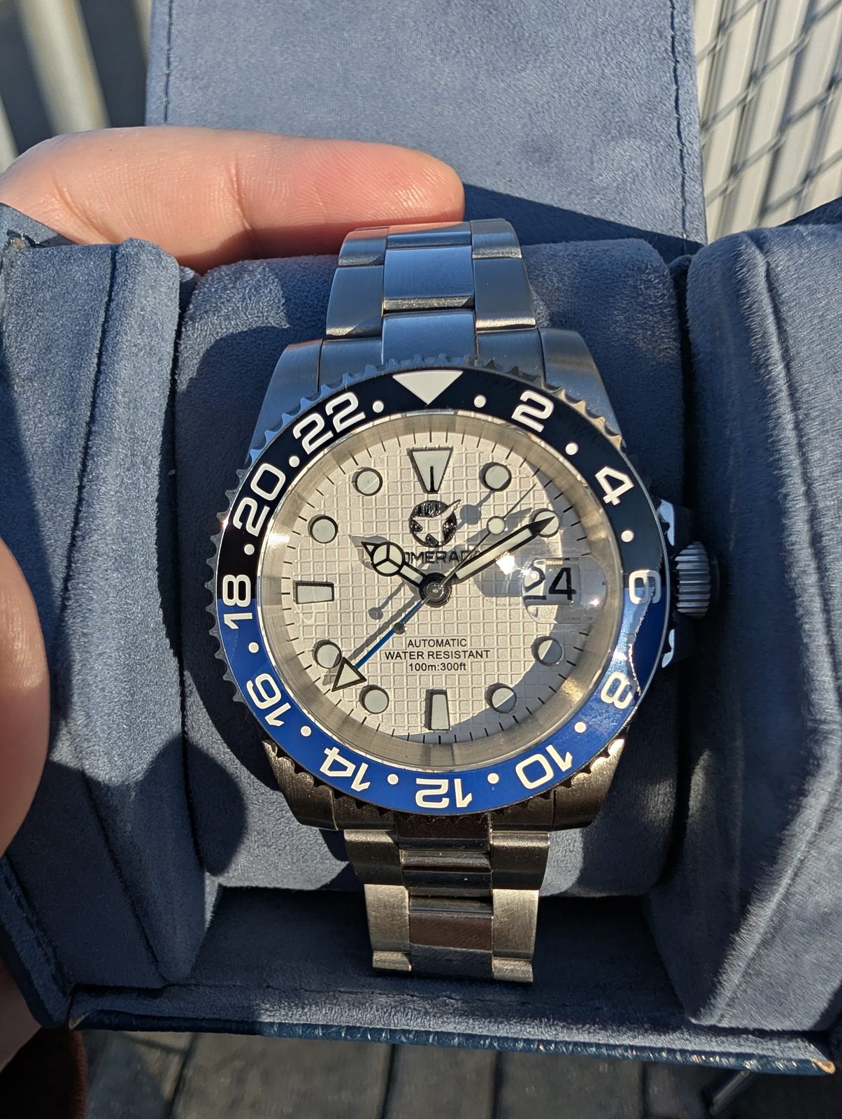 Cream dial GMT with black and blue bezel in travel case