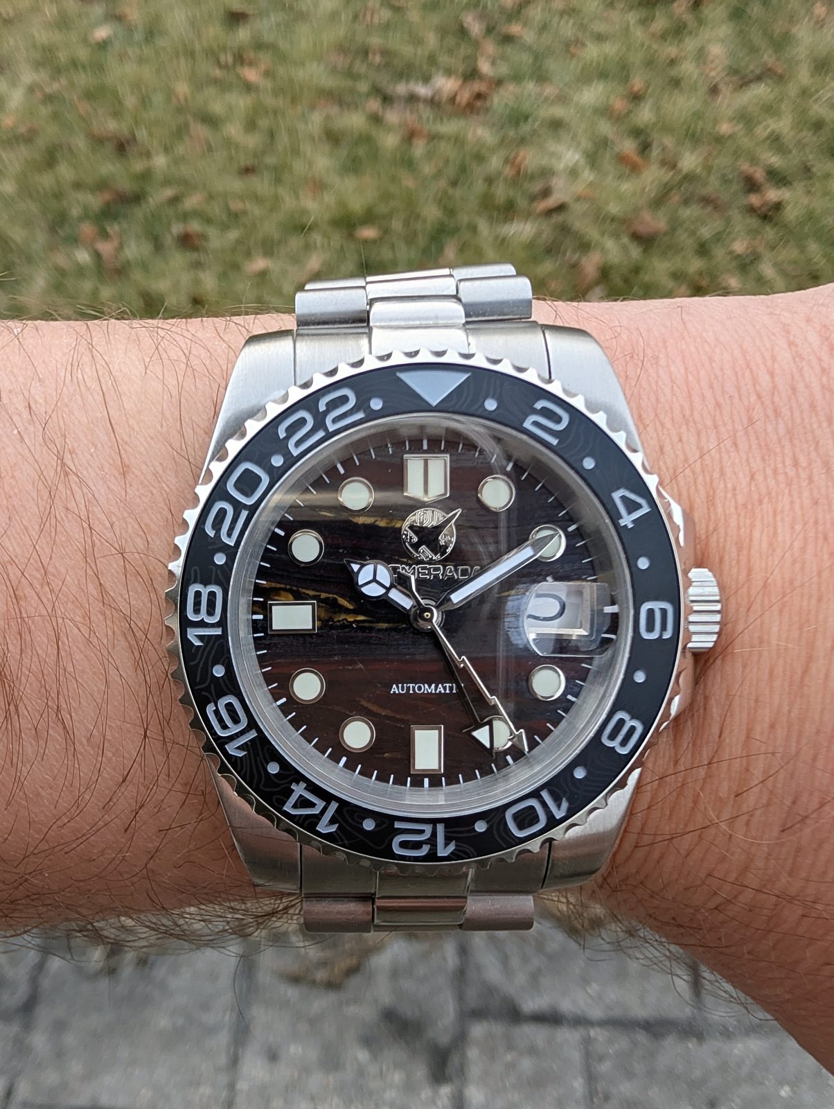 Black dial GMT with black bezel on wrist